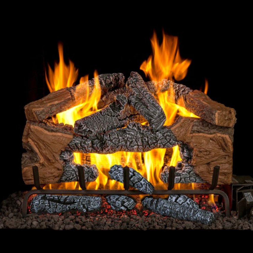 Charred cinder vented gas log set with burning flames in a metal burner grate