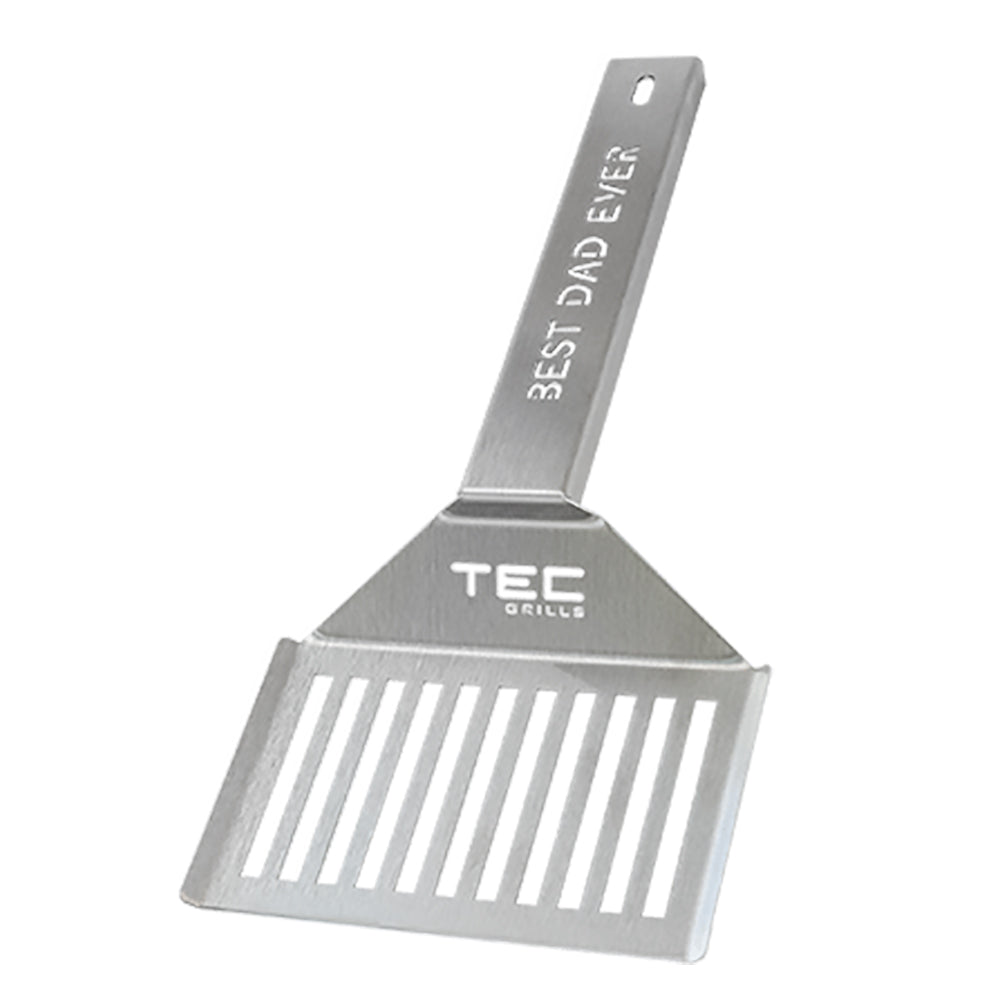 Metal grill spatula with ridged edge and TEC logo handle, engraved text.