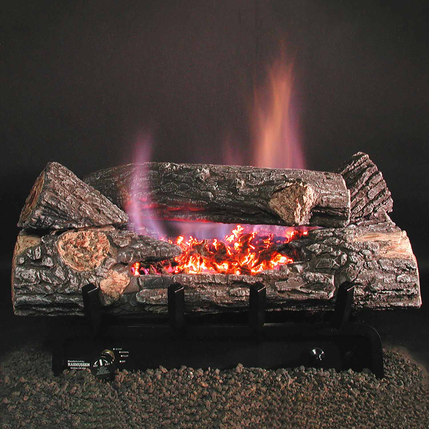 Ventless gas fireplace burner with glowing embers, charred log set, and active flames