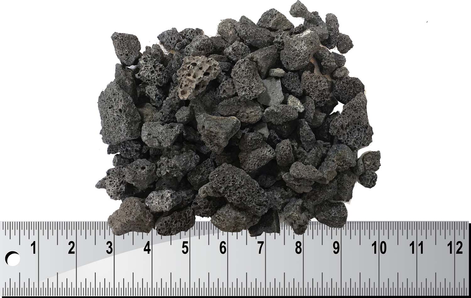 Lava rock pile in dark gray-black stones, assorted sizes