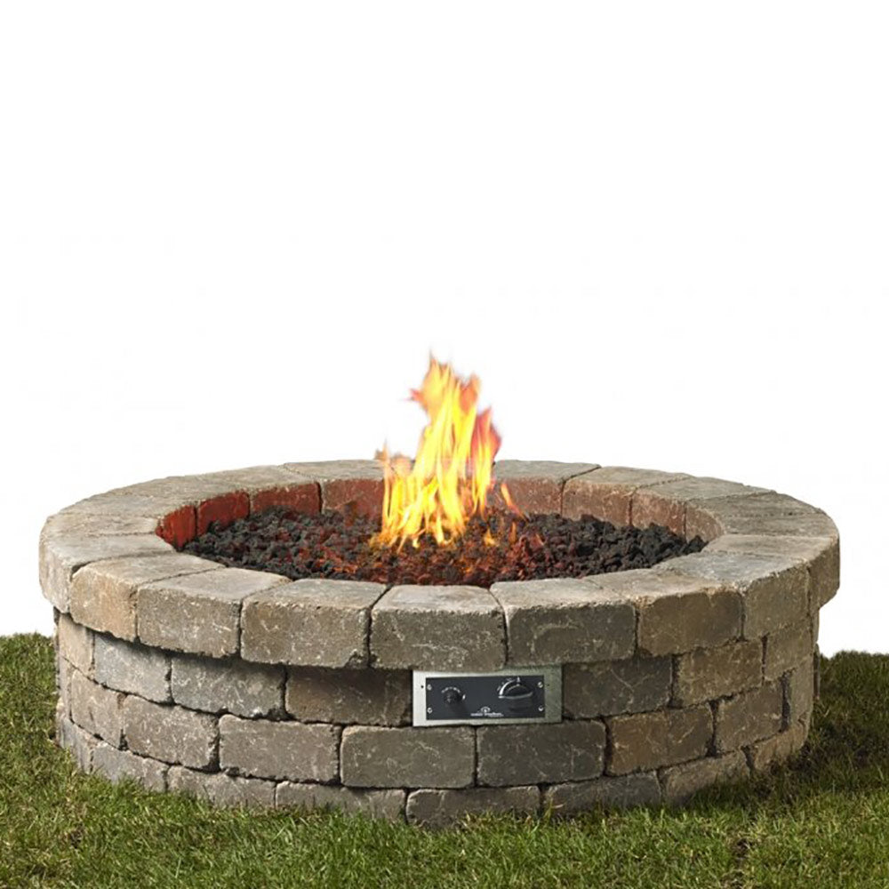 Round stone gas fire pit with glowing flames in center