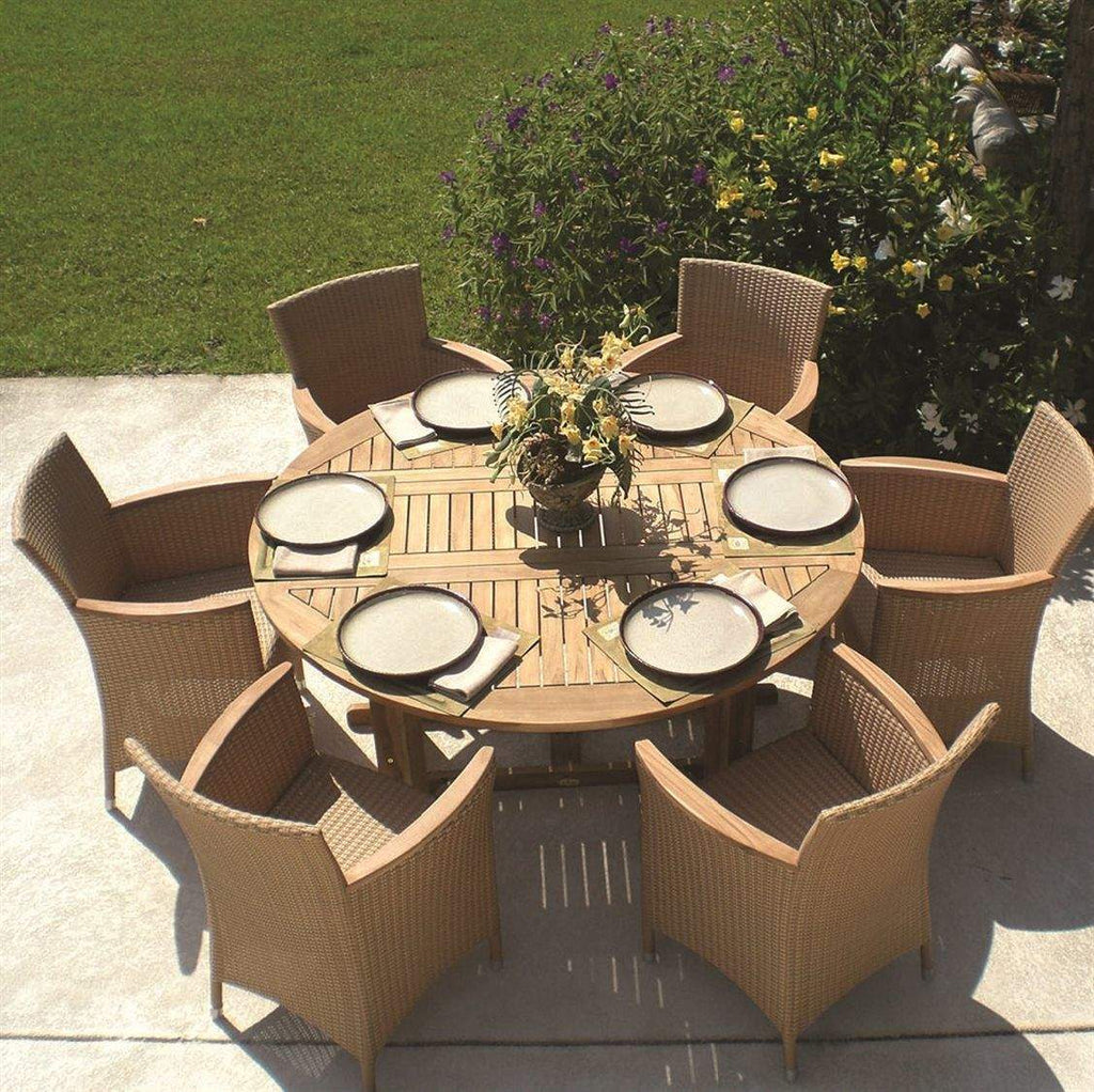 Teak round drop-leaf table with slatted surface, surrounded by outdoor chairs