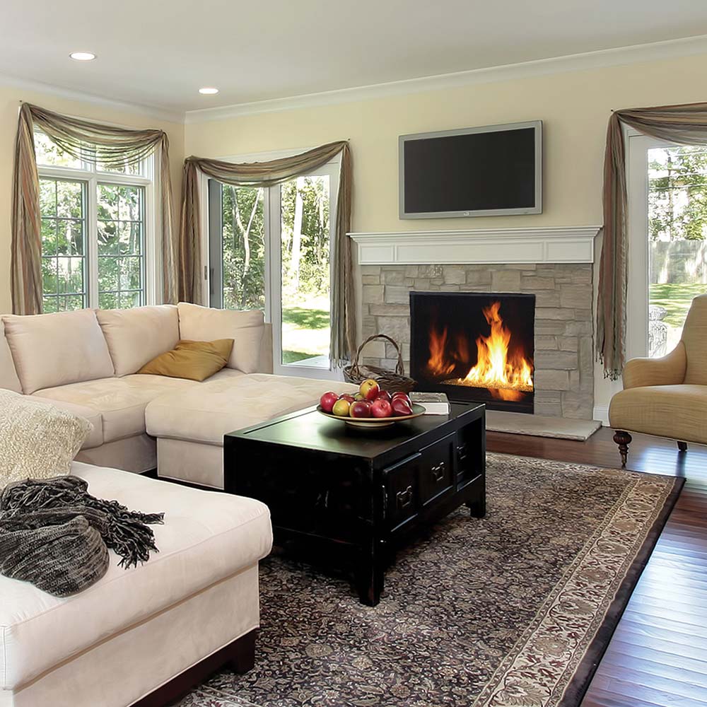 Direct vent gas fireplace insert with burning flames in a black firebox