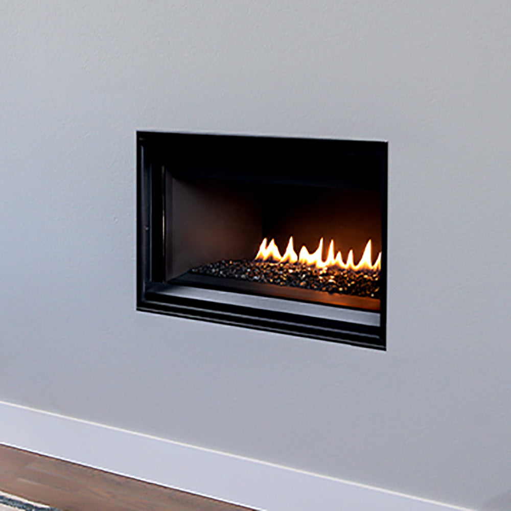 Wall-mounted direct vent gas fireplace with black frame, flames, and crushed glass bed
