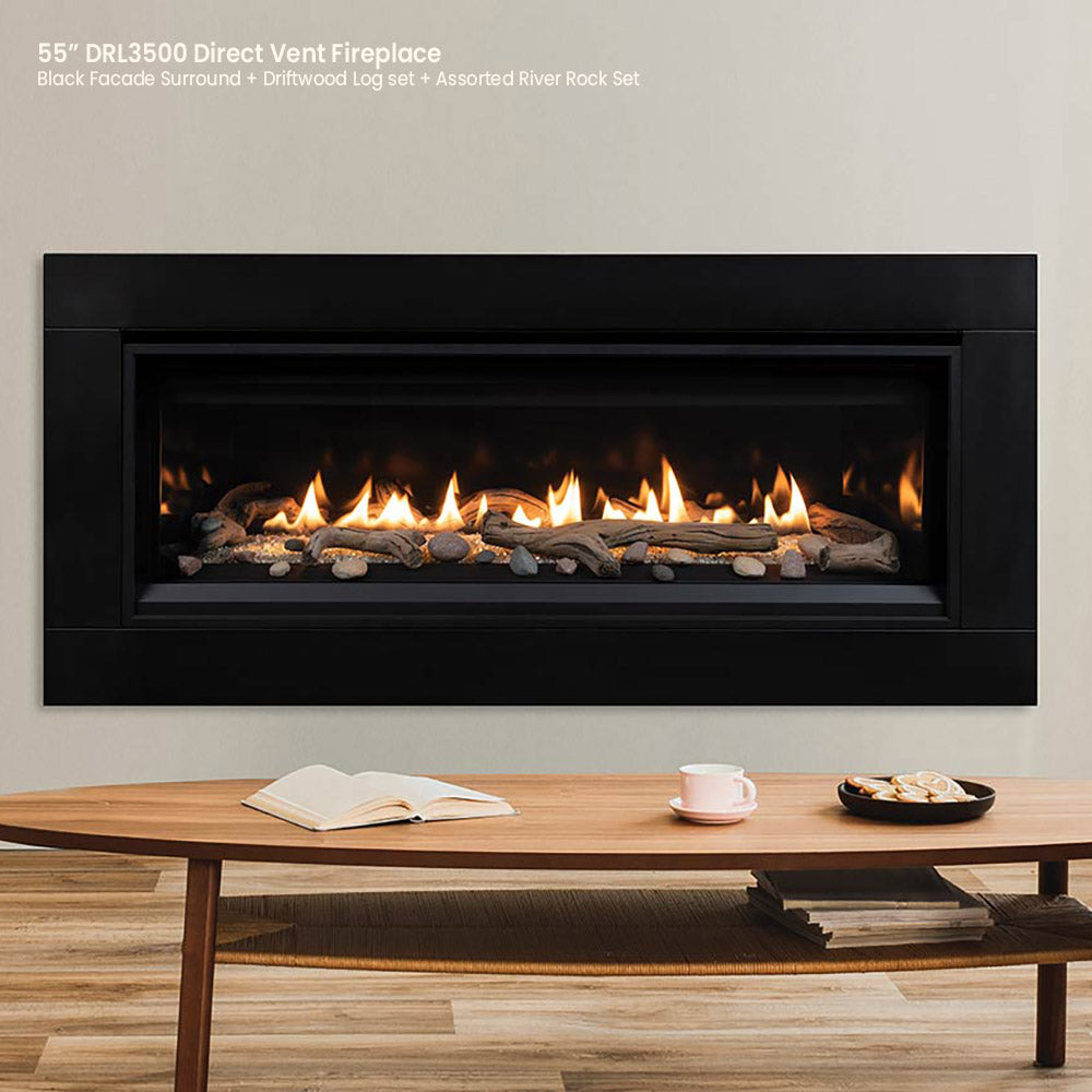 Direct vent gas fireplace with flames over crushed glass media, black face surround