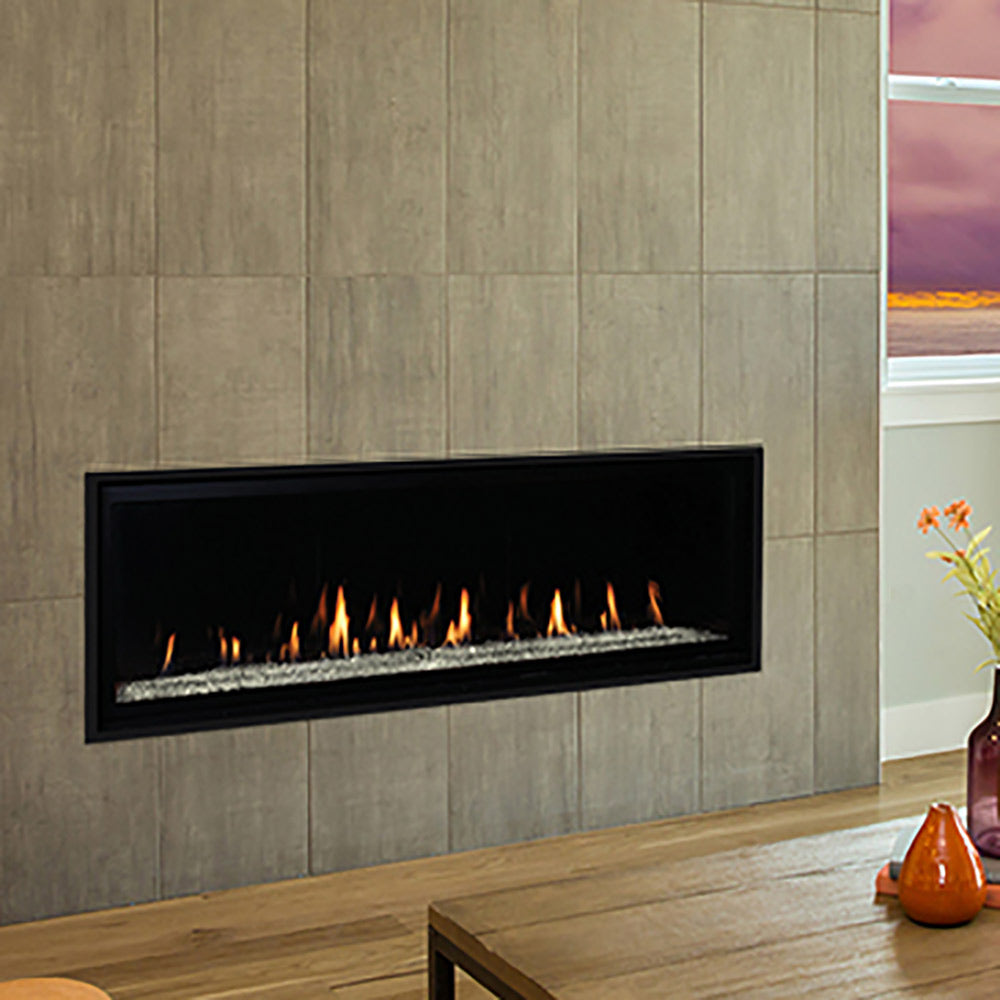 Built-in direct vent gas fireplace with black surround and flames over crushed glass media