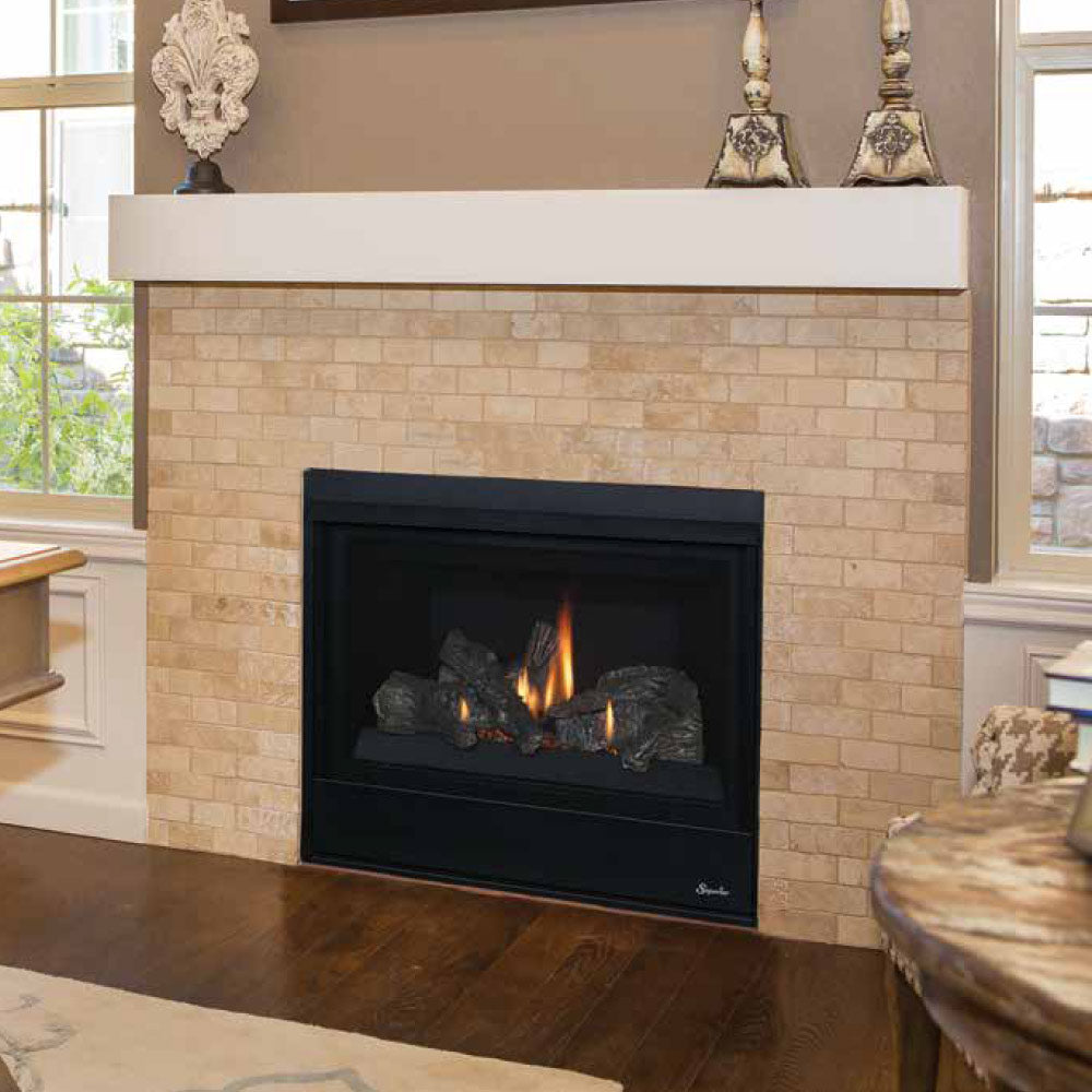 Direct vent gas fireplace with black trim in light stone surround, burning log set