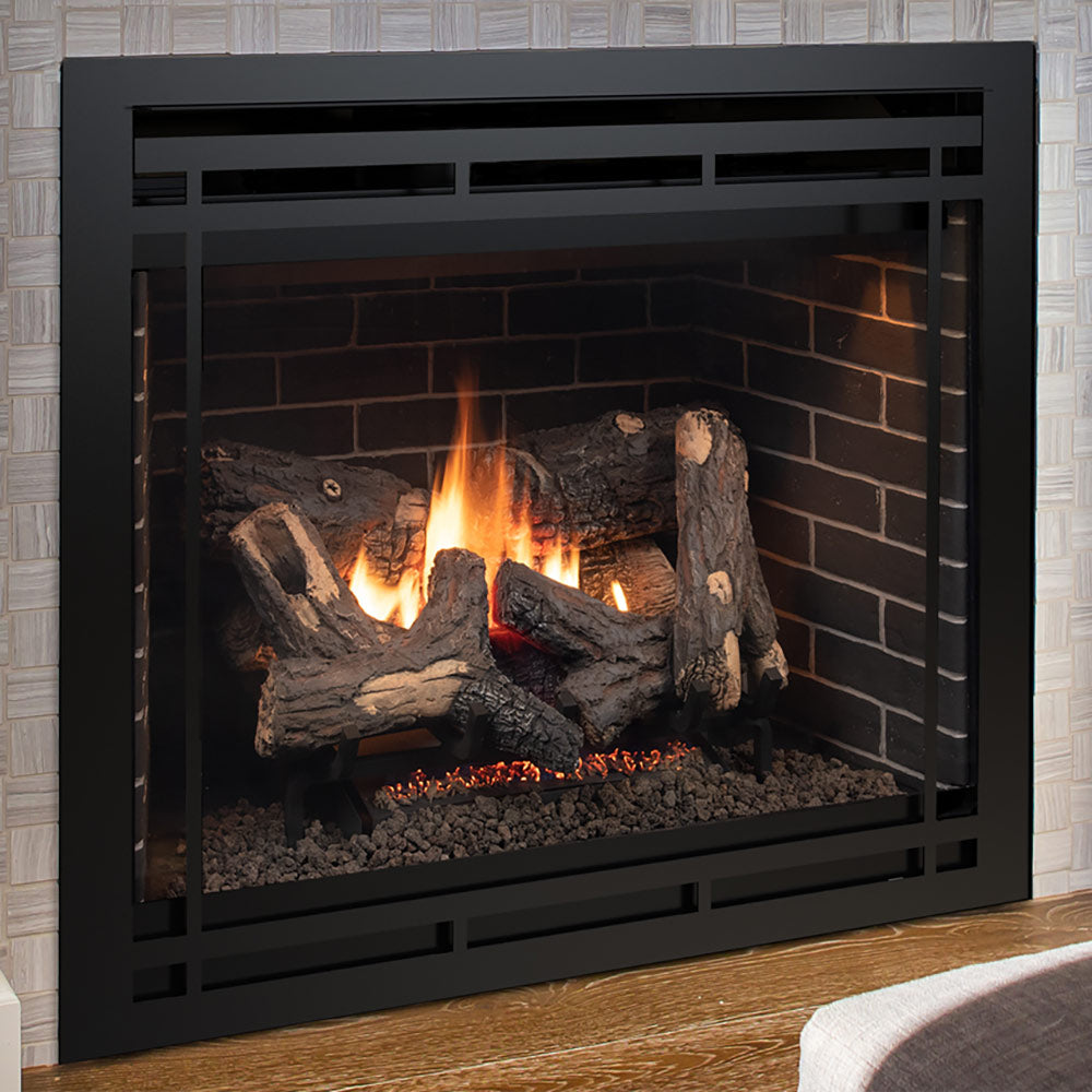 Black direct vent gas fireplace with flame over dark logs and pebble bed