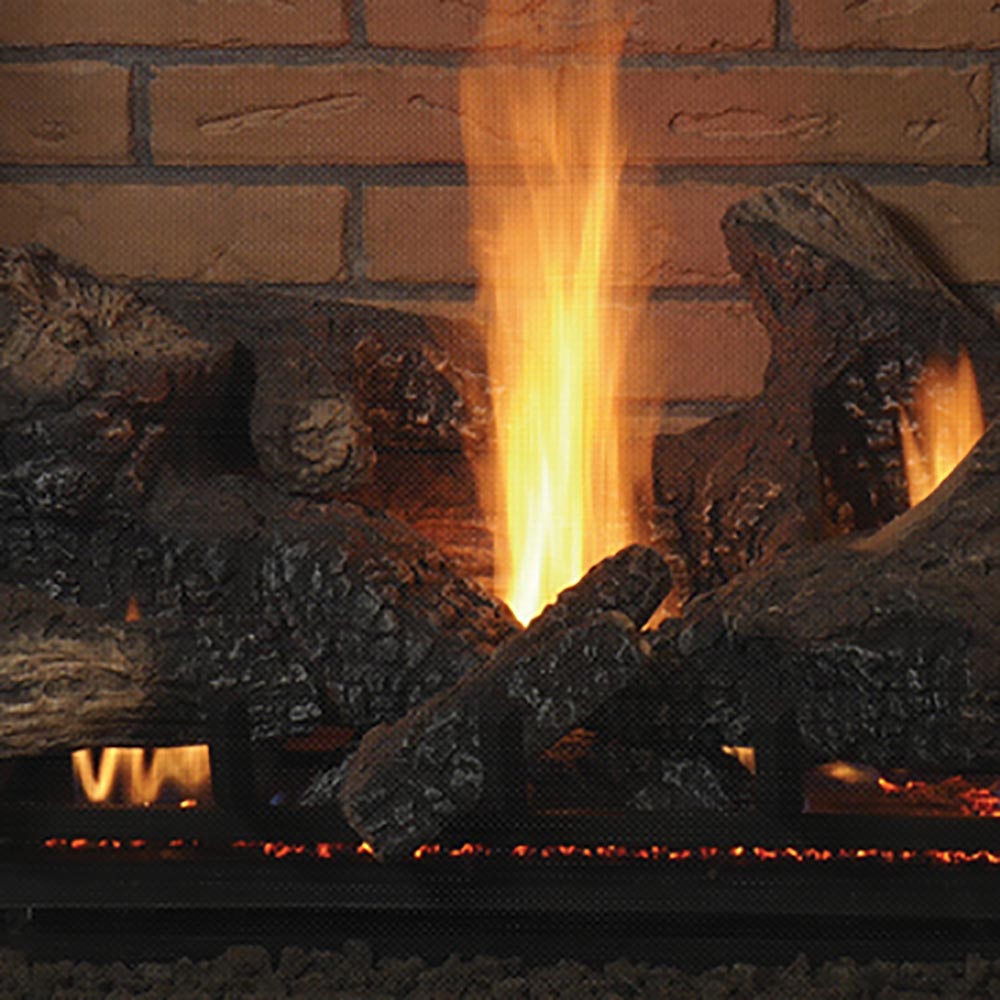 Close-up of direct vent gas fireplace flames over dark logs and ember bed