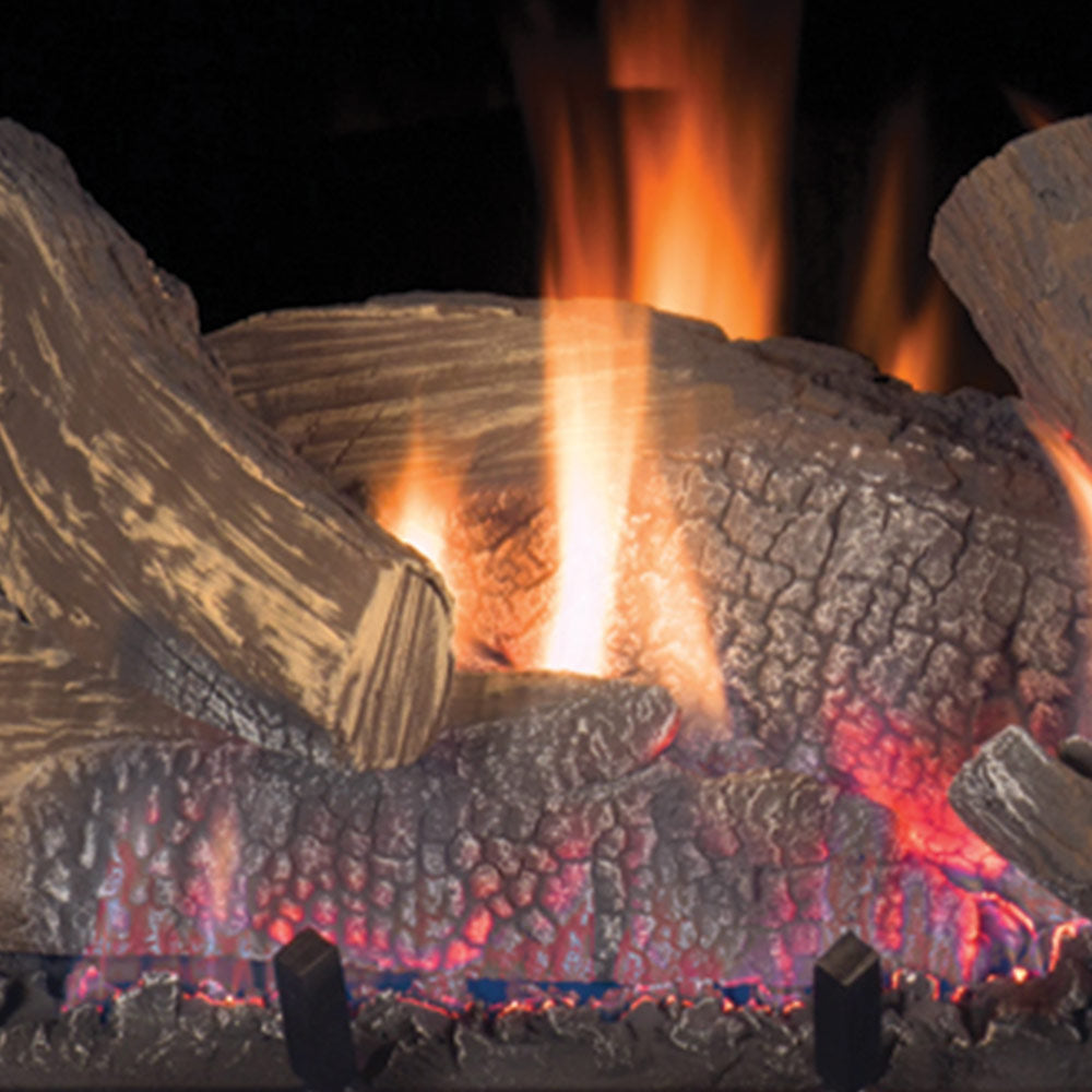 Flame and glowing logs inside a direct vent gas fireplace