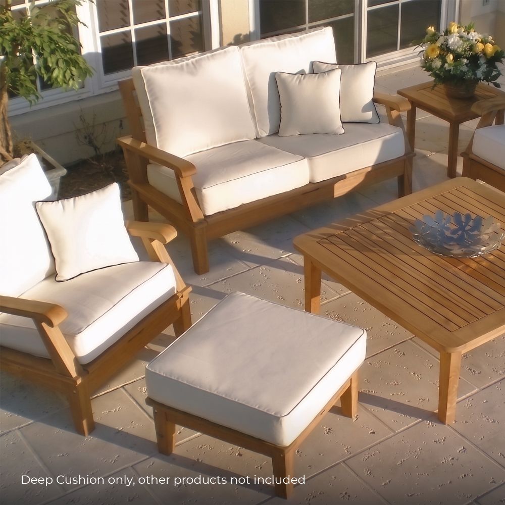 Square white seating cushion with smooth fabric and visible piping