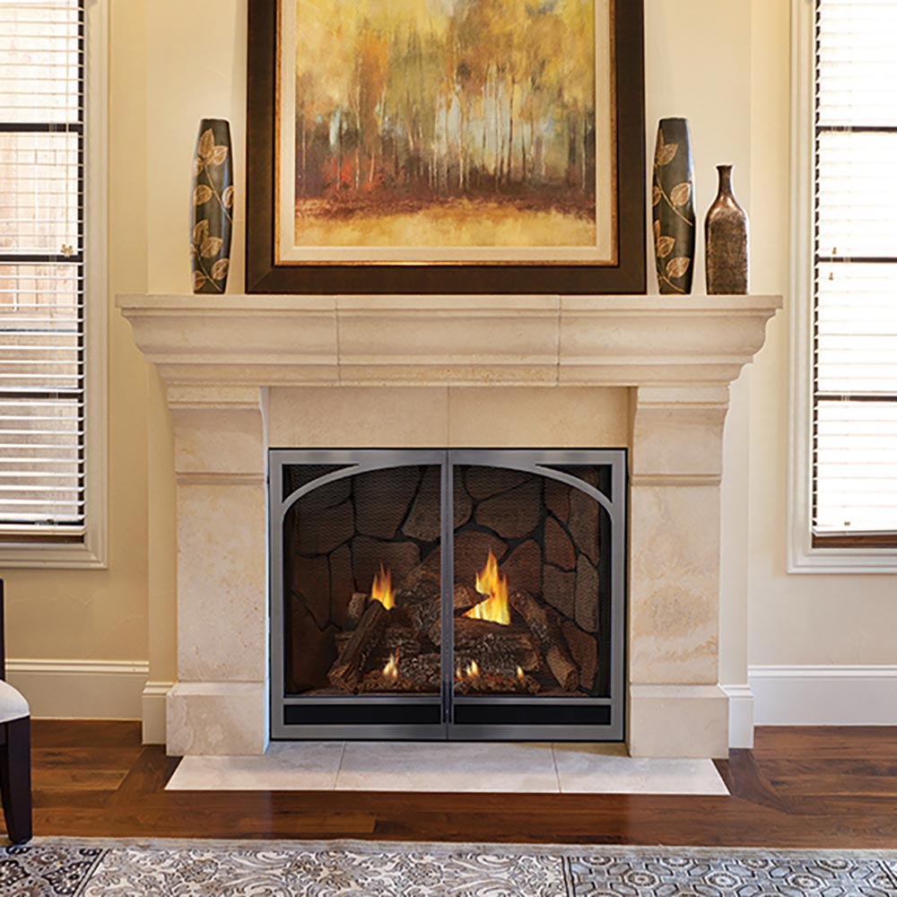 Direct vent gas fireplace set in a white mantel with black frame and burning logs