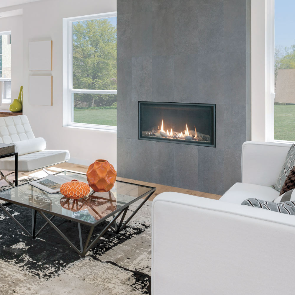 Contemporary direct vent fireplace with clear crushed glass and tall flames, wall-mounted