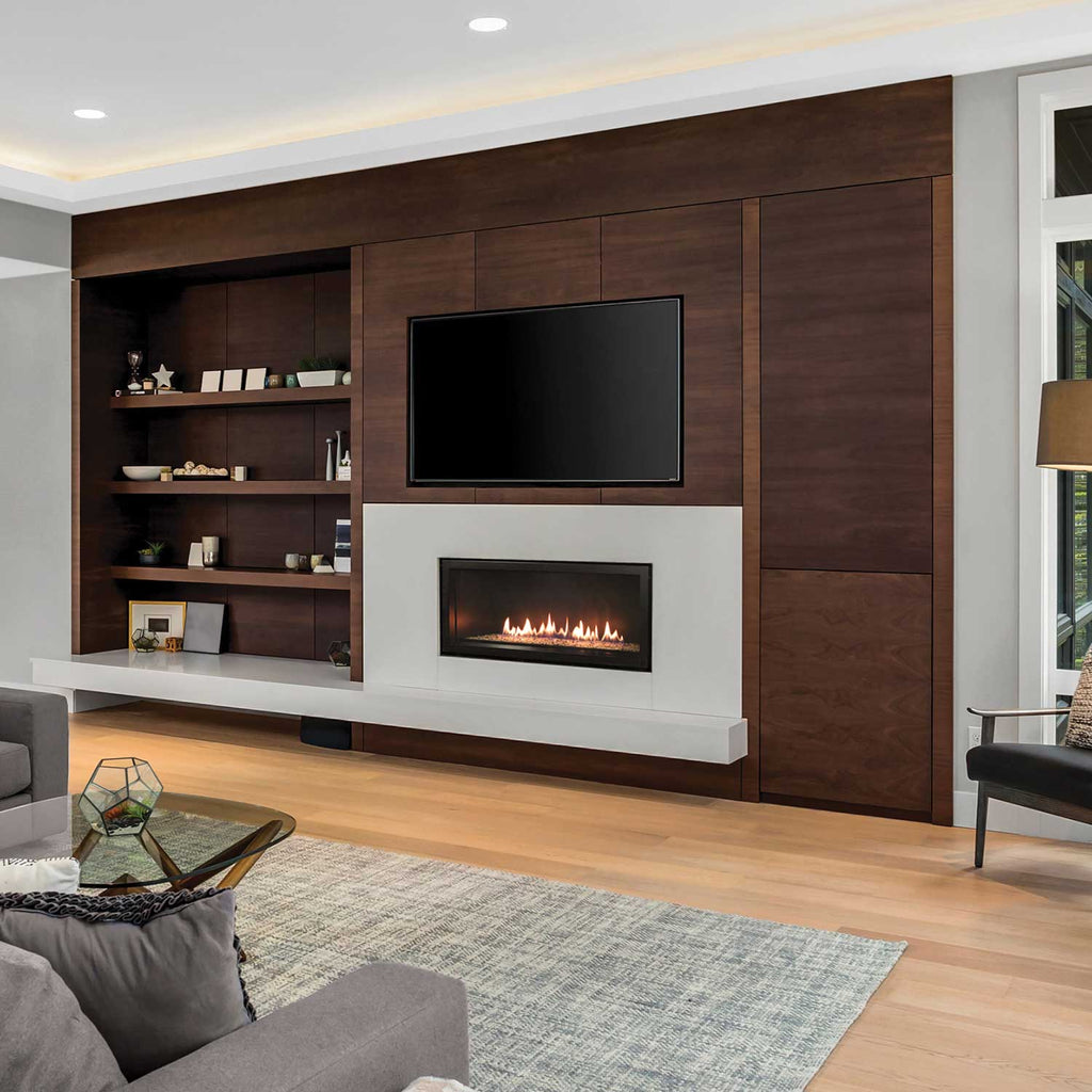 Linear direct-vent fireplace set into white wall with flames in a dark opening