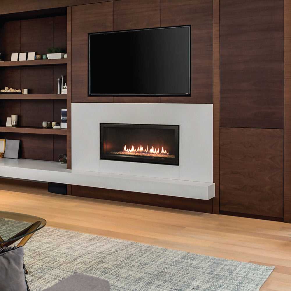 Linear direct vent gas fireplace with matte black liner and visible flame