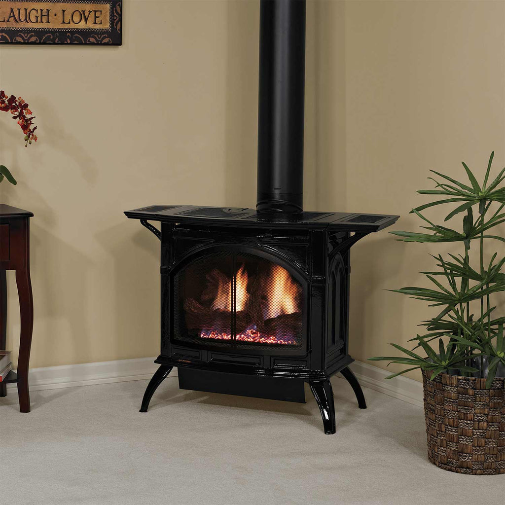 Black cast iron direct-vent stove with glass front and vertical flue pipe