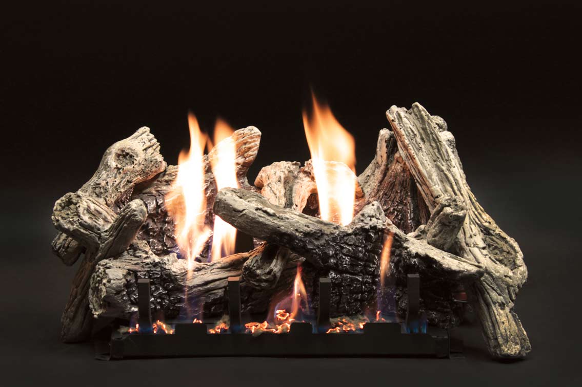 Driftwood-style gas logs with glowing flames on a rectangular burner
