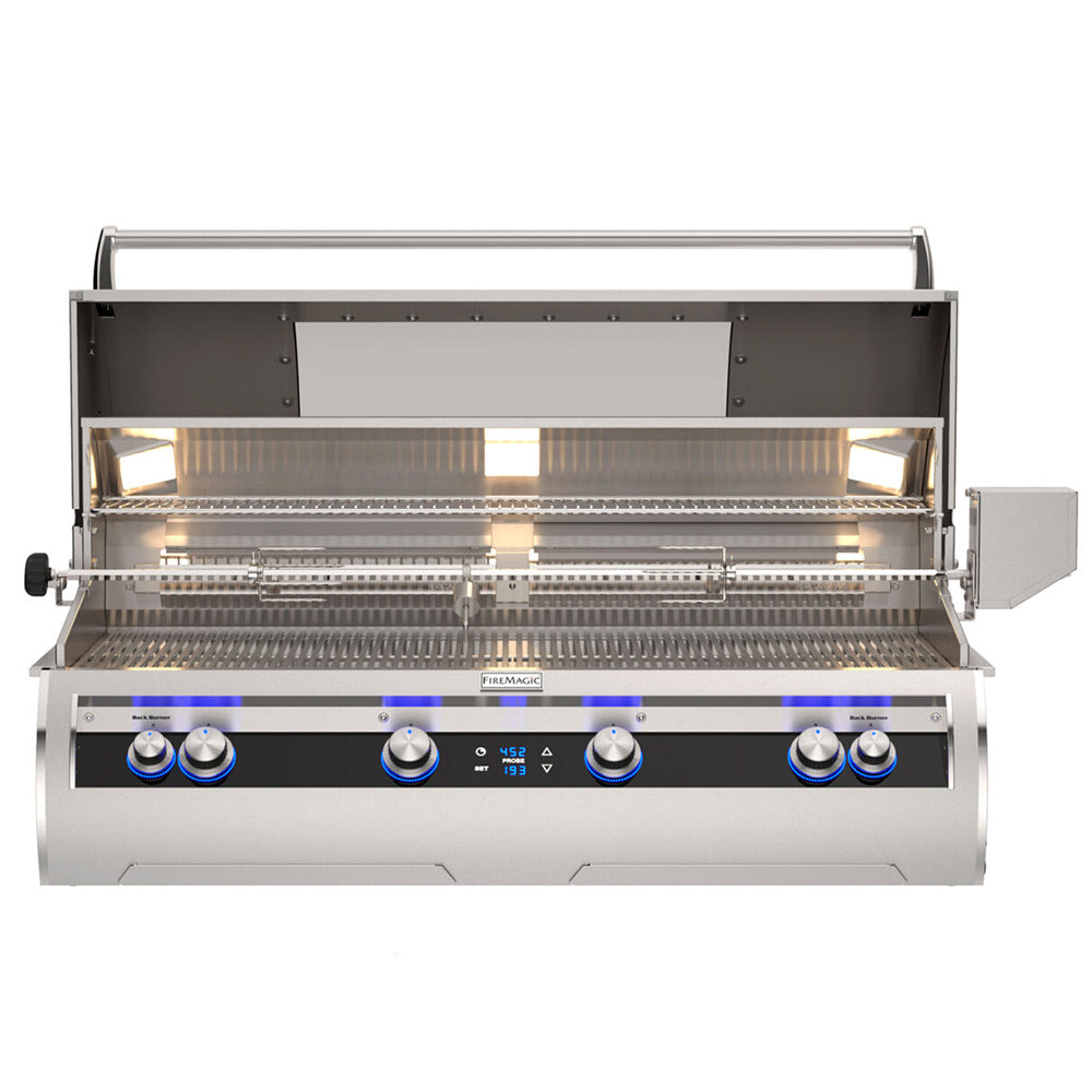 Built-in gas grill open with stainless hood, illuminated burners, and control knobs