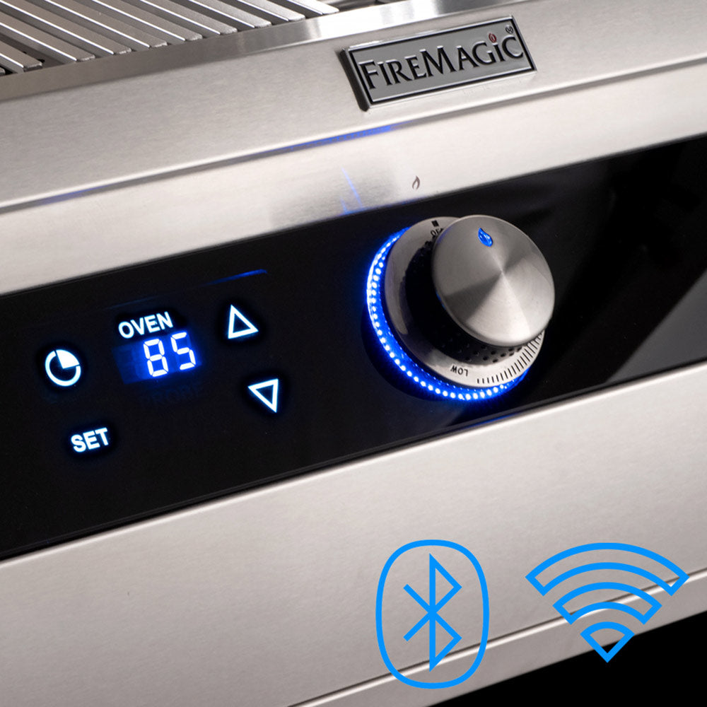 Portable gas grill control panel with digital readout, FireMagic logo, and blue indicator lights