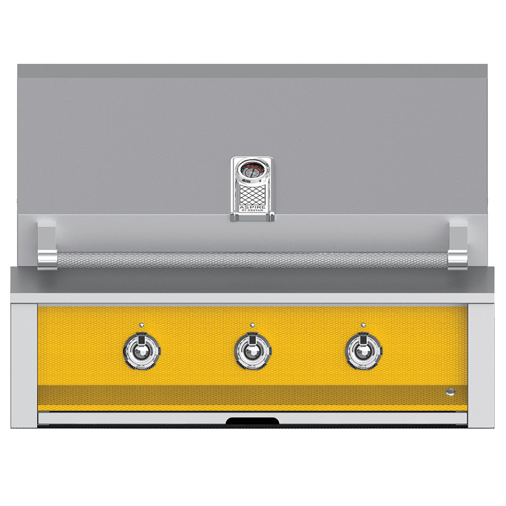 Built-in gas grill by Hestan, stainless front with four control knobs, yellow burner panel