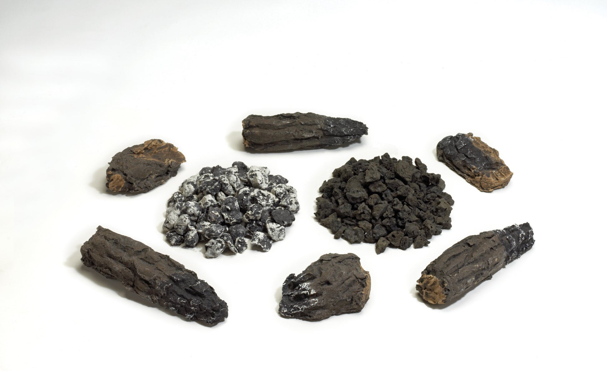 Fireplace ember kit with assorted dark stone pieces and small rock fragments