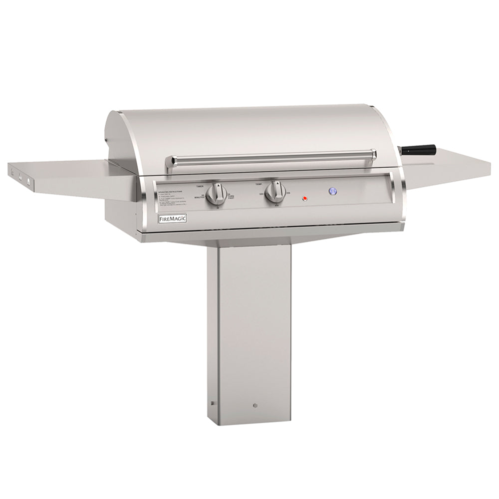 Stainless electric grill on pedestal post, lid closed, front analog control panel