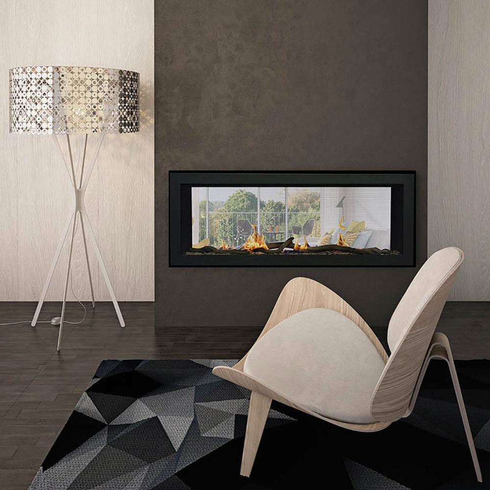 Linear gas fireplace with dark frame and glass window, flames visible above logs