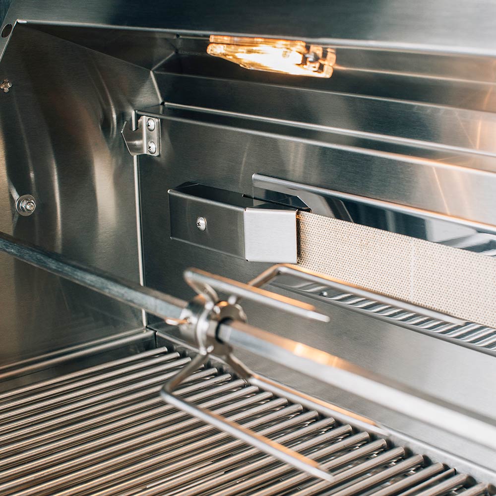 Stainless grill firebox with ceramic briquette tray and burner area