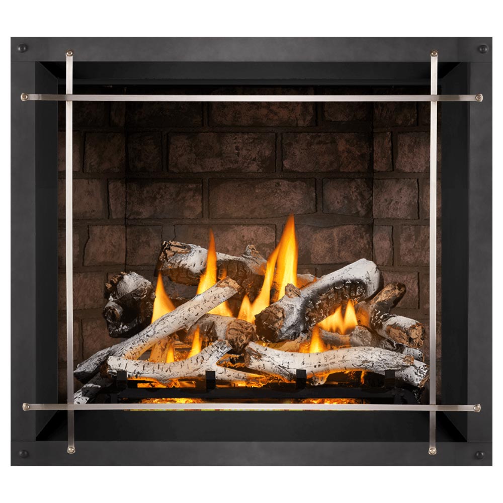 Direct vent gas fireplace with burning logs behind glass panel and light metal safety screen