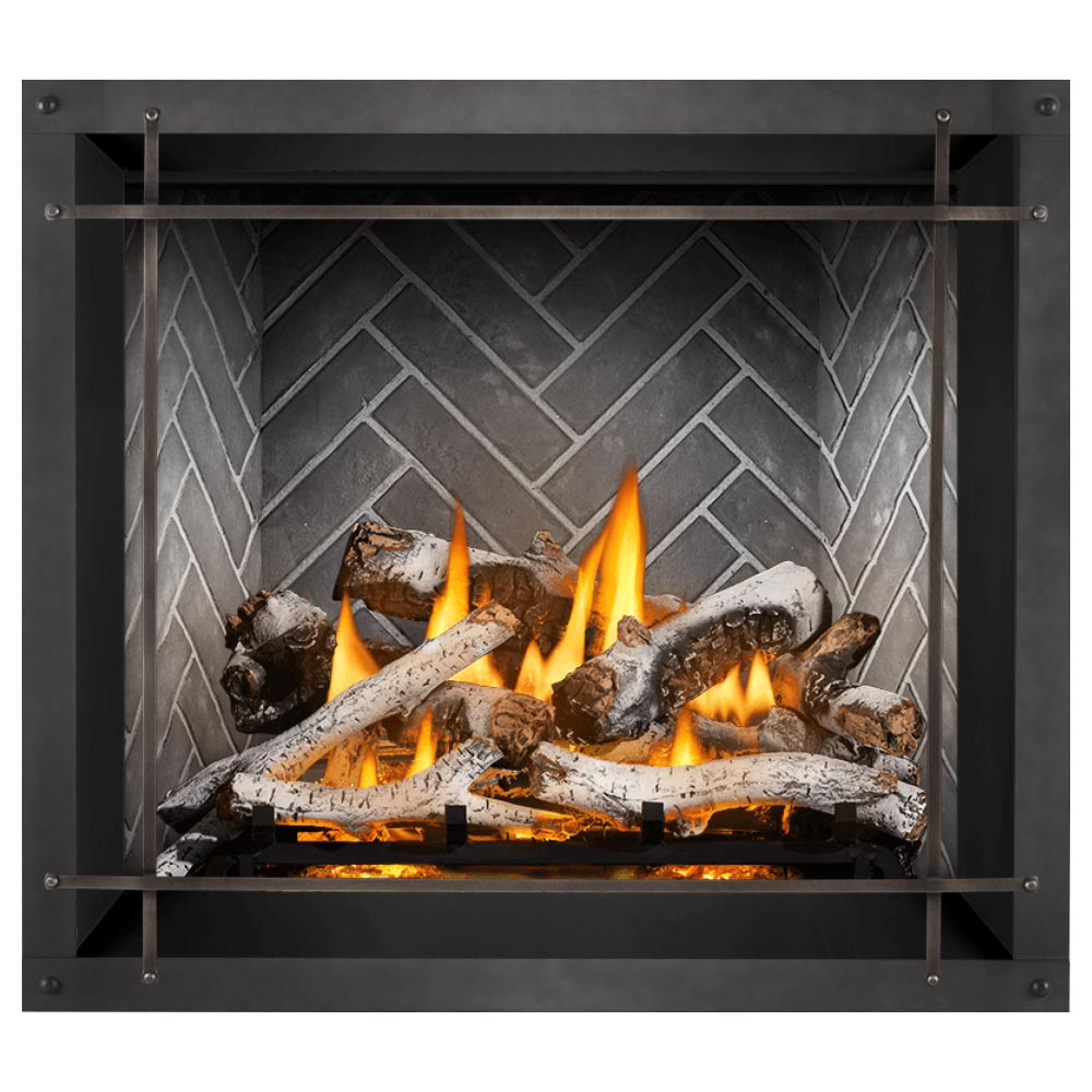 Direct vent gas fireplace with burning logs and gray stone backer behind dark glass frame