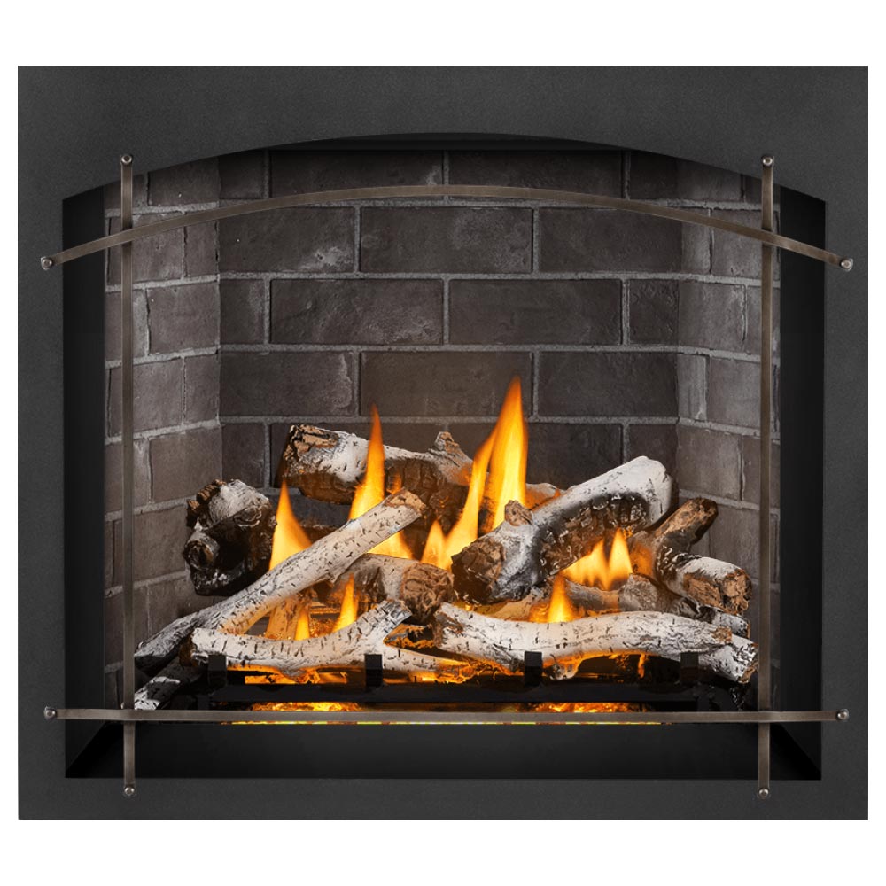 Direct vent gas fireplace showing active flames, charred logs, and gray stacked-stone firebox