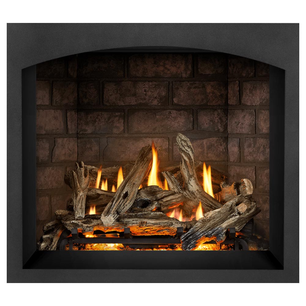 Direct vent gas fireplace with dark surround, burning logs and flames with brick backing