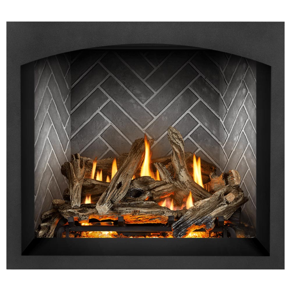 Direct vent gas fireplace showing burning logs with embers on gray brick back panel