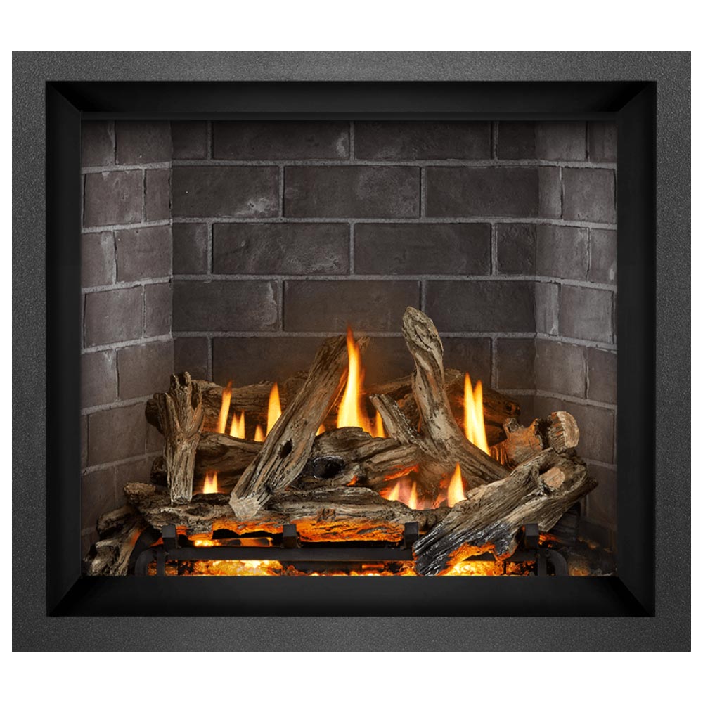 Gas fireplace insert with split log bed and orange flames in a dark metal surround