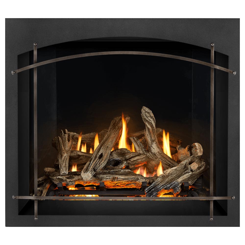 Direct vent gas fireplace firebox with burning logs, dark surround, and arched metal guard