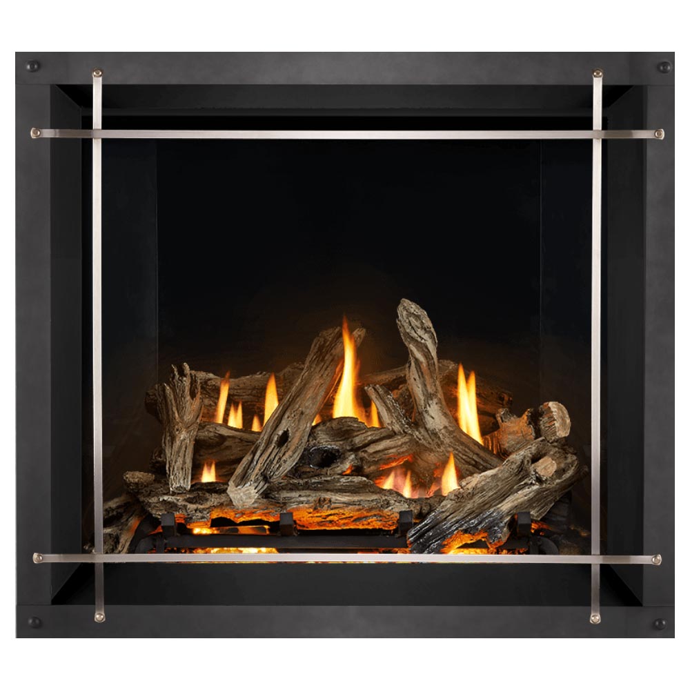 Direct vent gas fireplace firebox with burning logs, dark surround, and arched metal guard