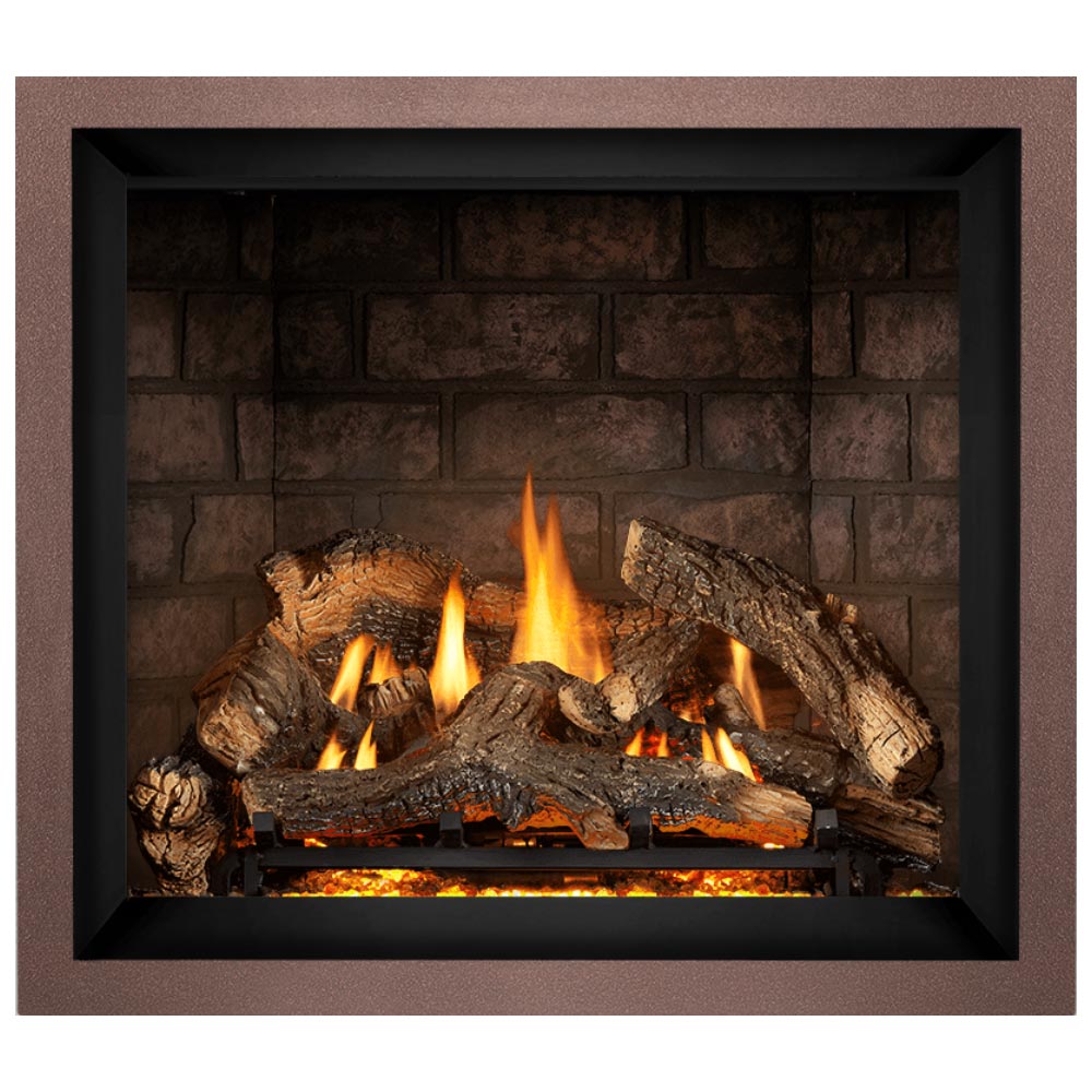 Gas fireplace insert with charred logs and orange flames against a brick back panel