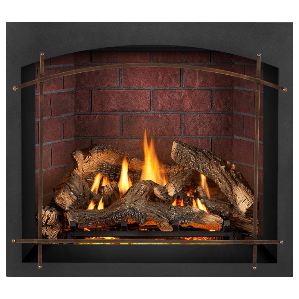 Gas fireplace insert with burning logs, arched metal frame, dark surround, red brick back