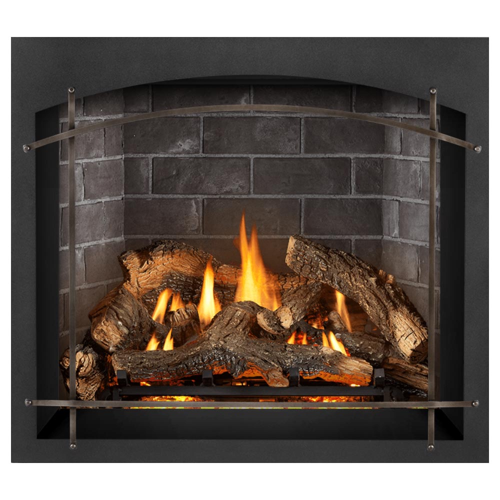 Gas fireplace insert with burning logs, arched metal frame, dark surround, gray brick back