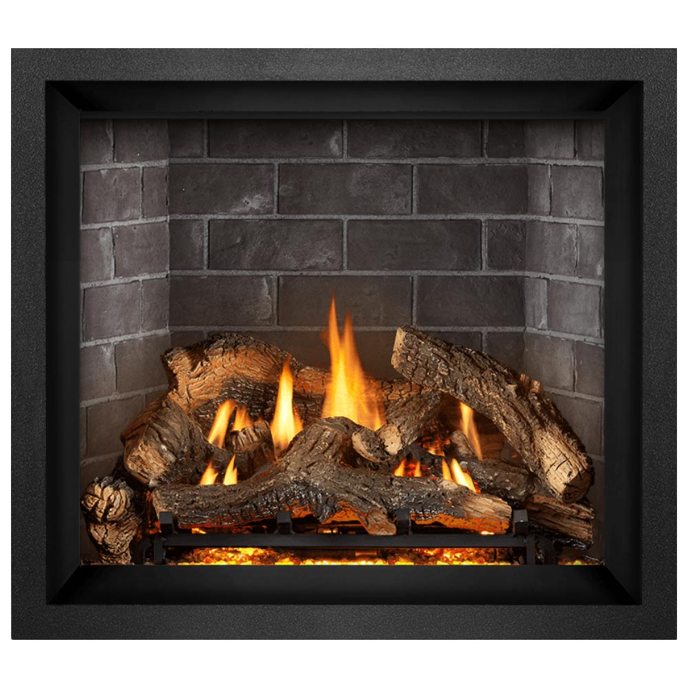 Direct vent gas fireplace with dark frame and burning logs against gray brick wall