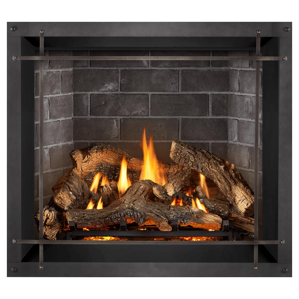 Gas fireplace insert with burning logs, arched metal frame, dark surround, gray brick back