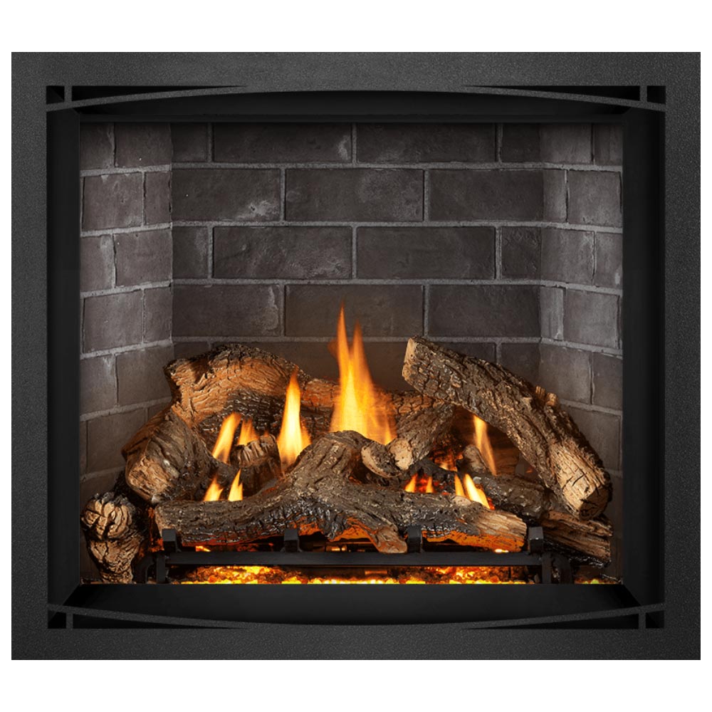 Direct vent gas fireplace with thick logs and orange flames glowing in the firebox