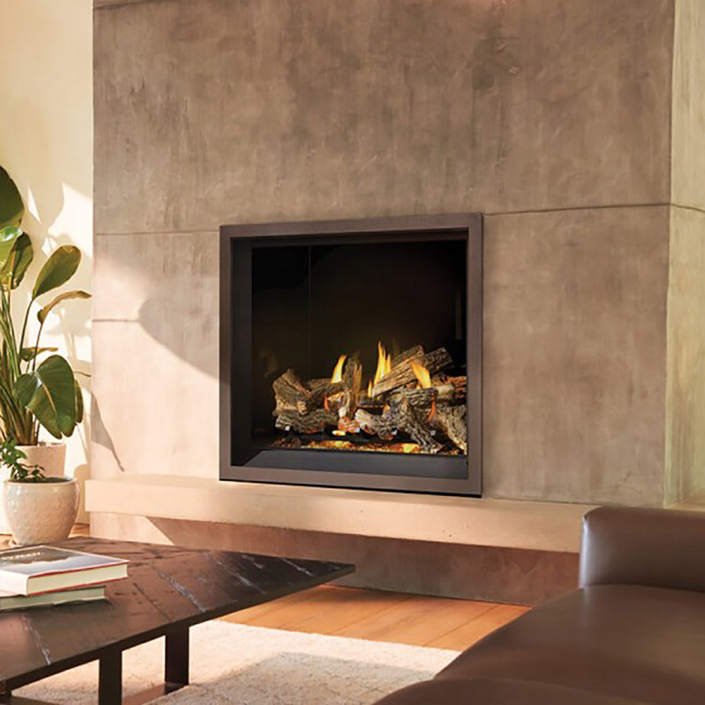 Direct vent gas fireplace insert with black frame and burning logs in living room