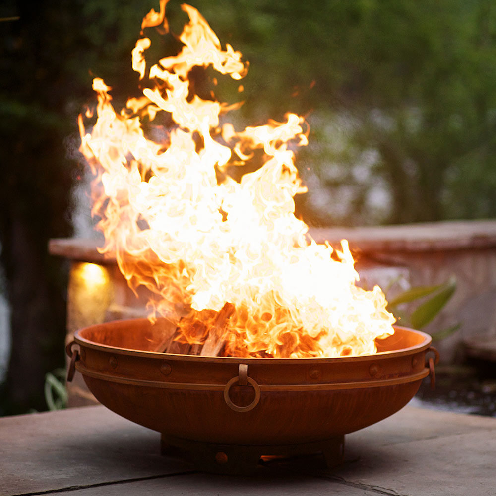 Emperor wood fire pit with tall flames in bronze bowl