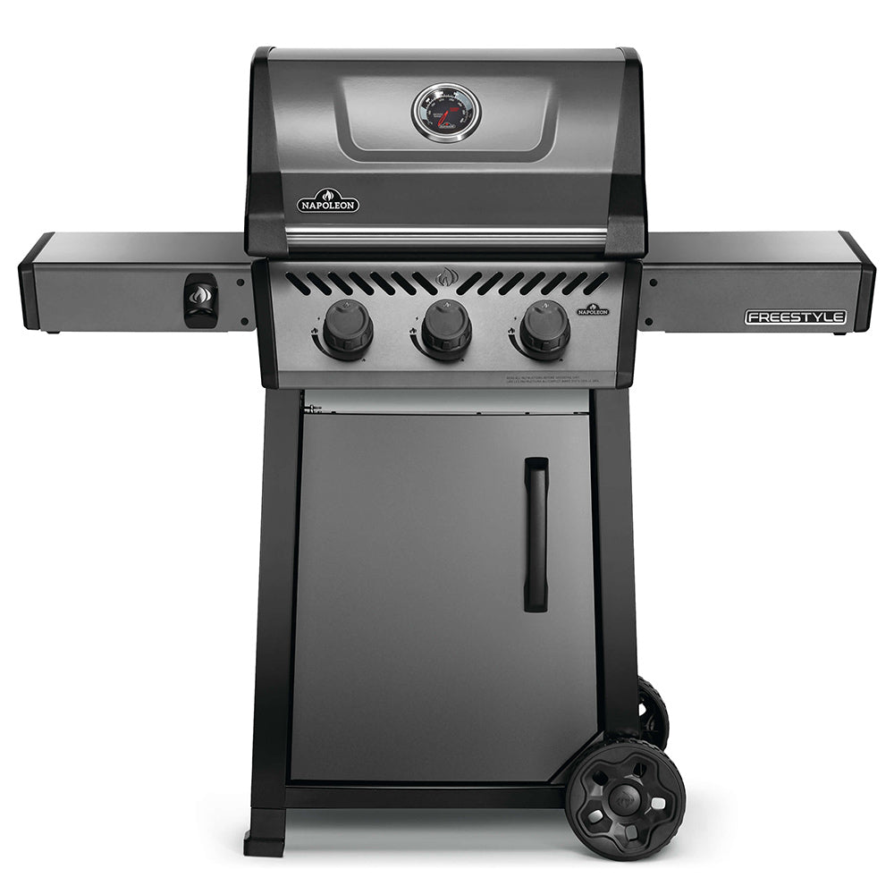Freestyle 365 gas grill on cart, front view with control knobs and lid
