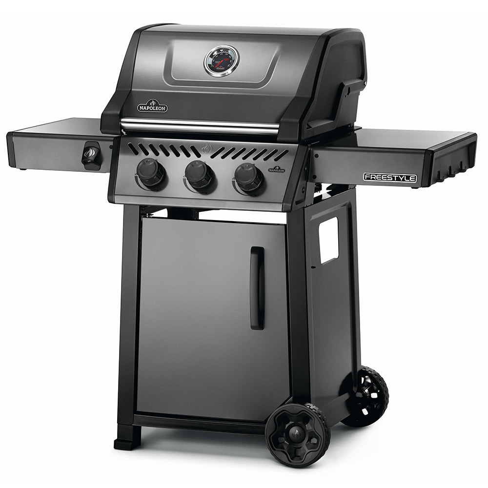 Freestyle 365 gas grill on cart, angled view with side shelf and control panel