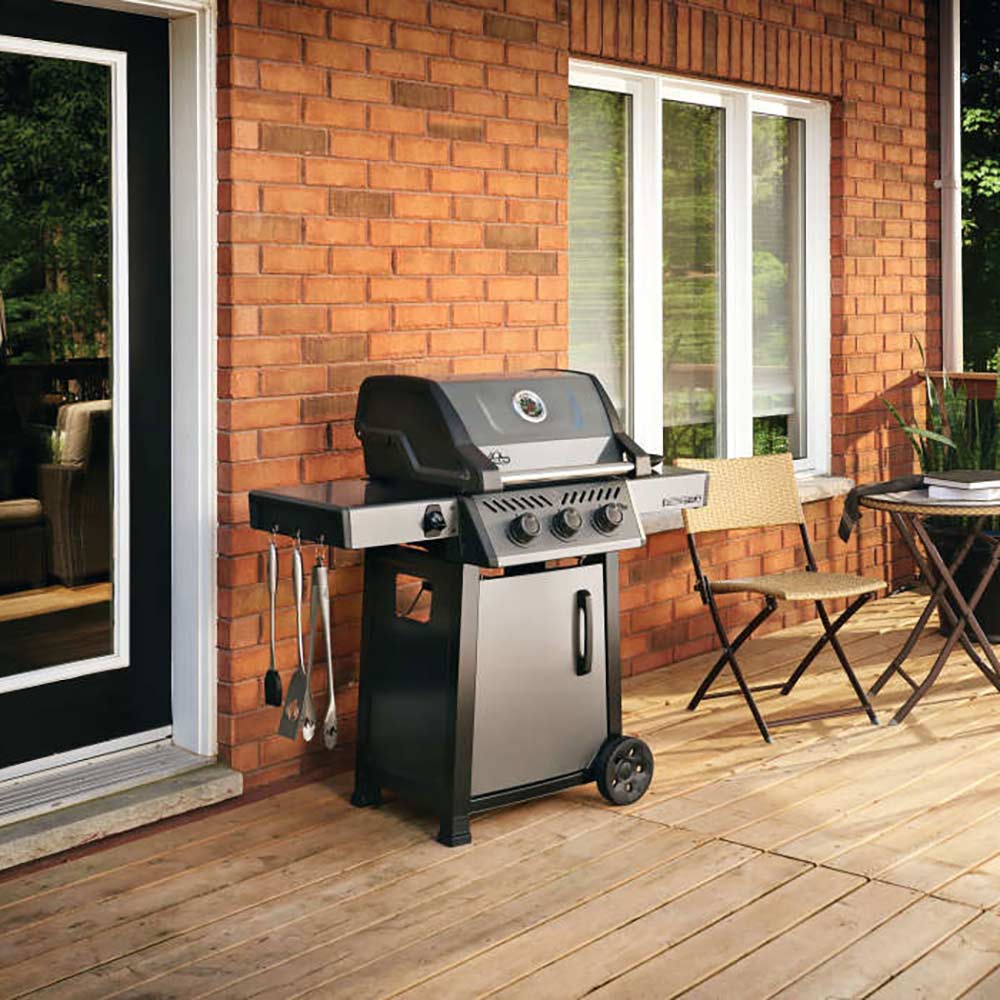 Freestyle 365 gas grill on cart, outdoor patio setup with closed lid