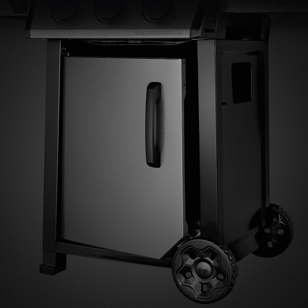Propane gas grill with open cabinet door and side handle