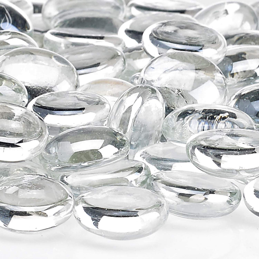 Fire glass beads close-up, transparent ice-clear oval beads with shine