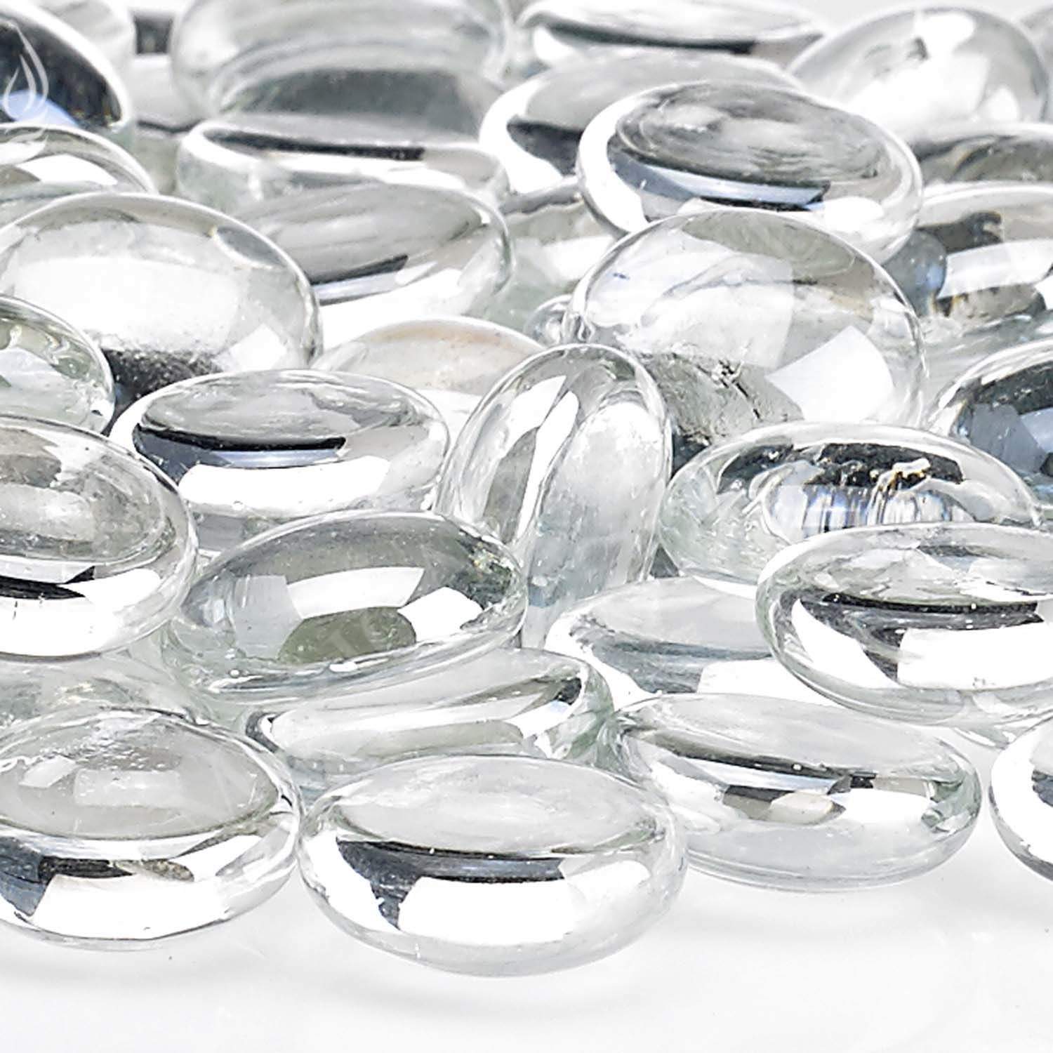Fire glass beads close-up, transparent ice-clear oval beads with shine